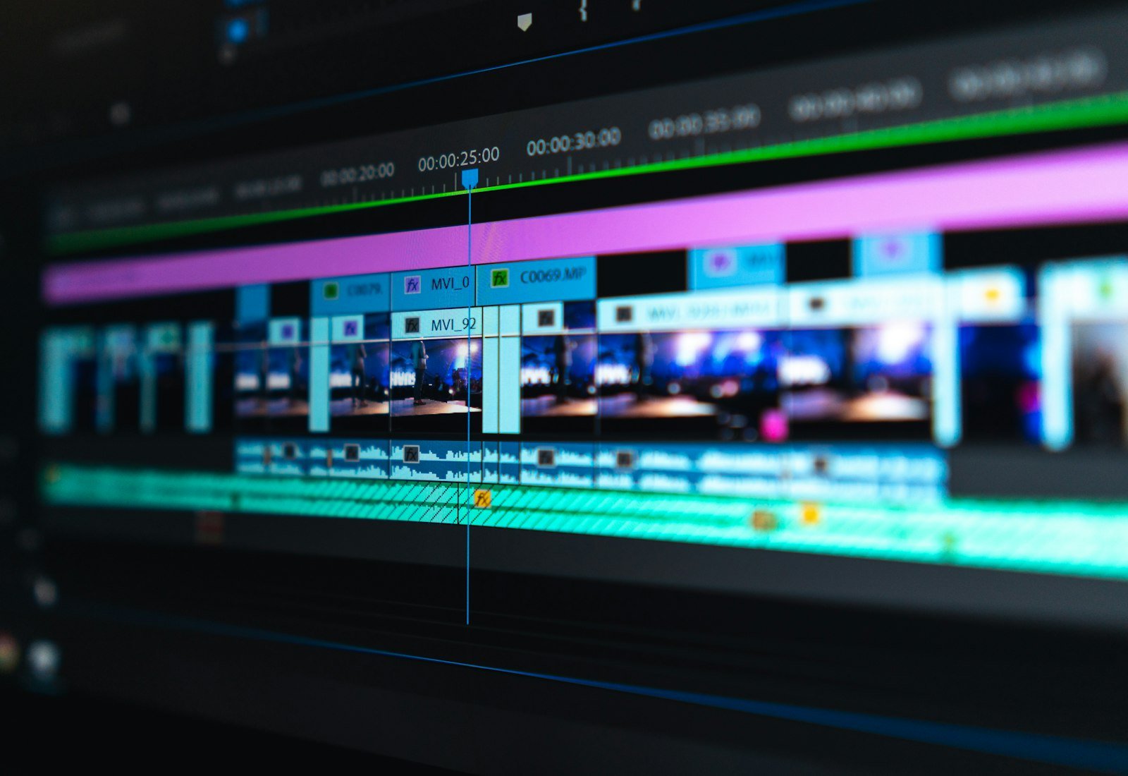 Video editing timeline with clip thumbnails, markers and a playhead